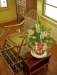 flowersnexttosnowshoerockerwoodenfloorvisible_small.jpg